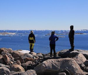 Three expeditioners admire the view at Jack Huts