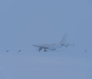 Aircraft taking off on ice runway in the snow