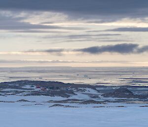 View out to sea of ice bergs with station in distance