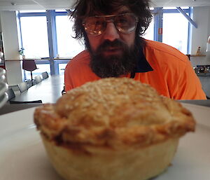 Expeditioner looking at a pie
