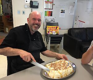 Andrew cutting a birthday cake