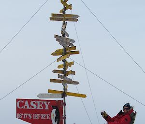 Linc with the Casey sign in red jacket and shorts