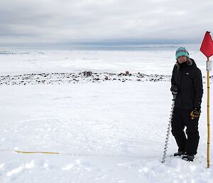 Expeditioner with cane and ice drill