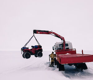 Truck lifting a quad bike