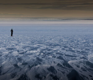 Expeditioner standing on snow