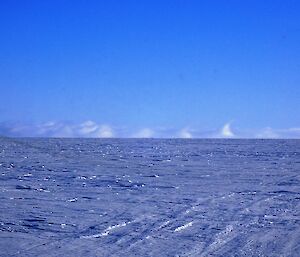 Wave like clouds on the horizon