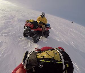 Two quad bikes stopped on snow