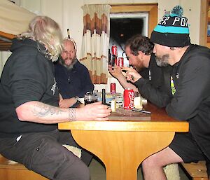Expeditioners sitting around a table