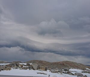 Clouds with dome building in foreground