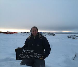 Simo holding sign