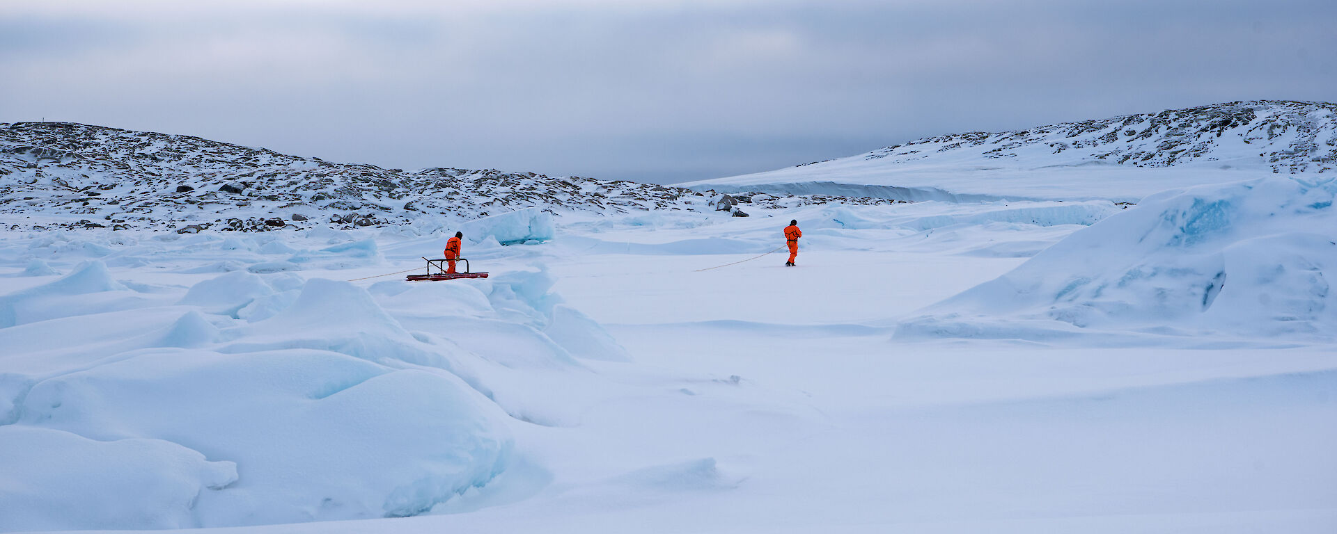 Two expeditioners on sea ice