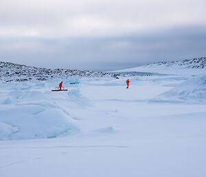 Two expeditioners on sea ice
