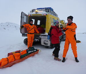 Expeditioners at the back of a Hägglunds