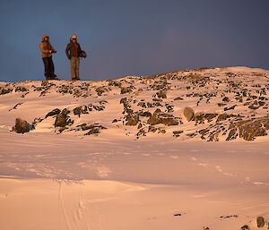 Two expeditioners on the hill top