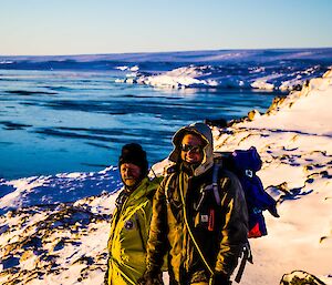 Two expeditioners with sea in background