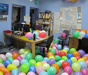 Station leader office filled with balloons