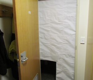 Donga door covered in paper