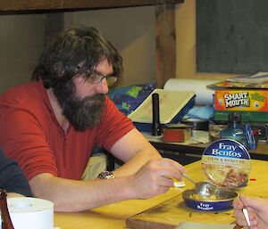 Scottish eating a Fray Bentos pie.