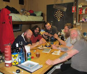 Group of expeditioners in a hut.