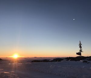 Sunrise behind the Casey sign.