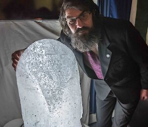 Chris and the ice penguin that he carved