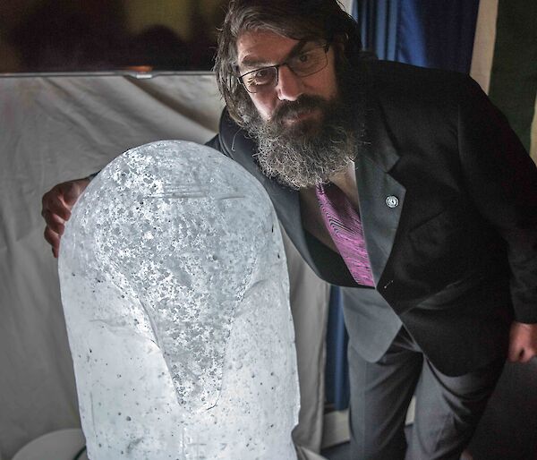 Chris and the ice penguin that he carved