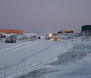 The transfer hose laid out on a nicely prepared snow bed