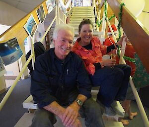 Two expeditioners sitting on stairs