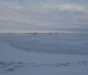 View of station across broken sea ice.