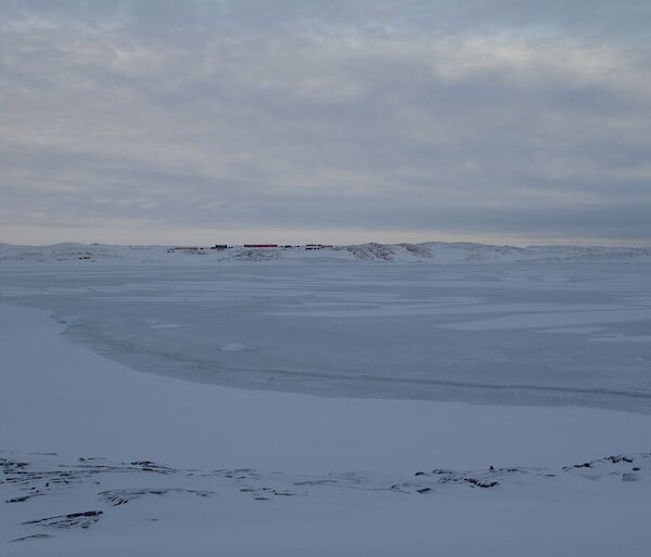 View of station across broken sea ice.