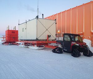 Van and vehicles in front of workshop.