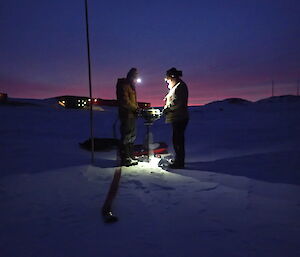 Ducky and Watto on the lake drilling in the dark