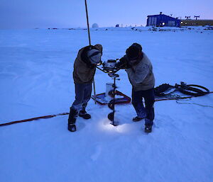 Ducky and Watto drilling the lake