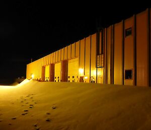 Snow built up against the workshop.