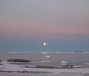 Moonrise over the ocean.