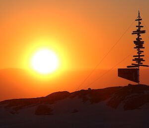 Sunrise behind Casey sign.