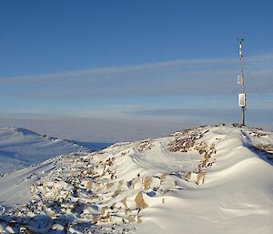 Mast with weather station on a hill