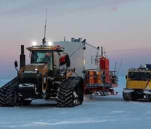Two vehicles on the ice travelling to Haupt Nunataks.