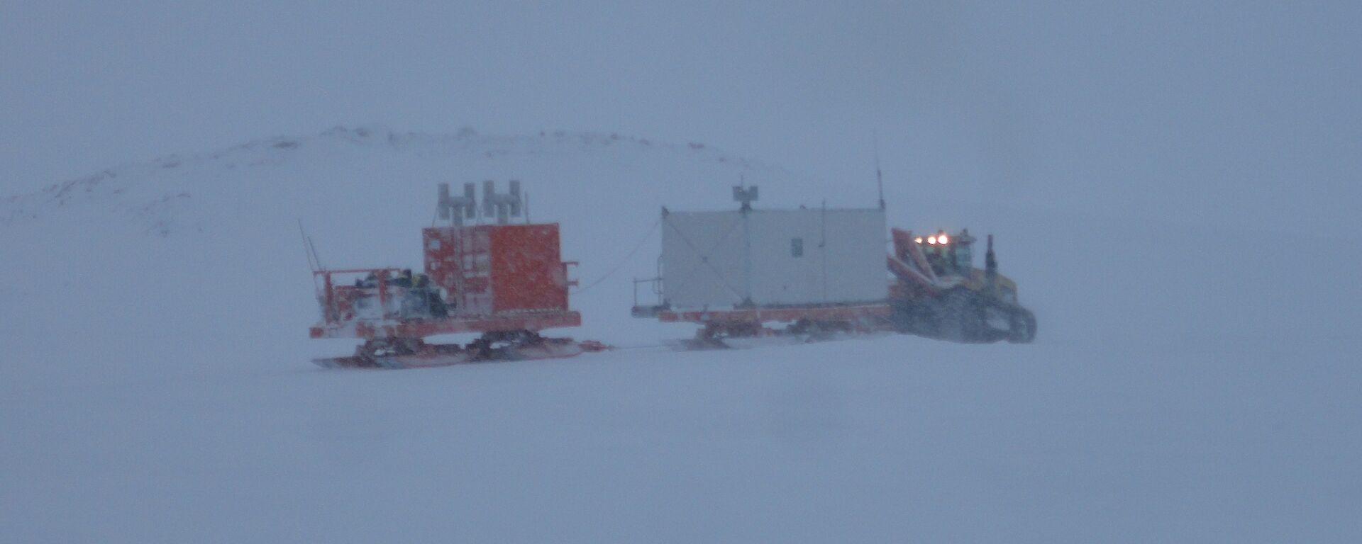 Vehicles heading off in snowy conditions