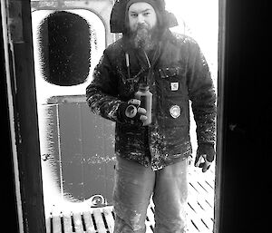 Brendan outside a building in the cold.