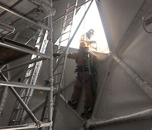 Clint inside the ANARESAT working on a damaged area.