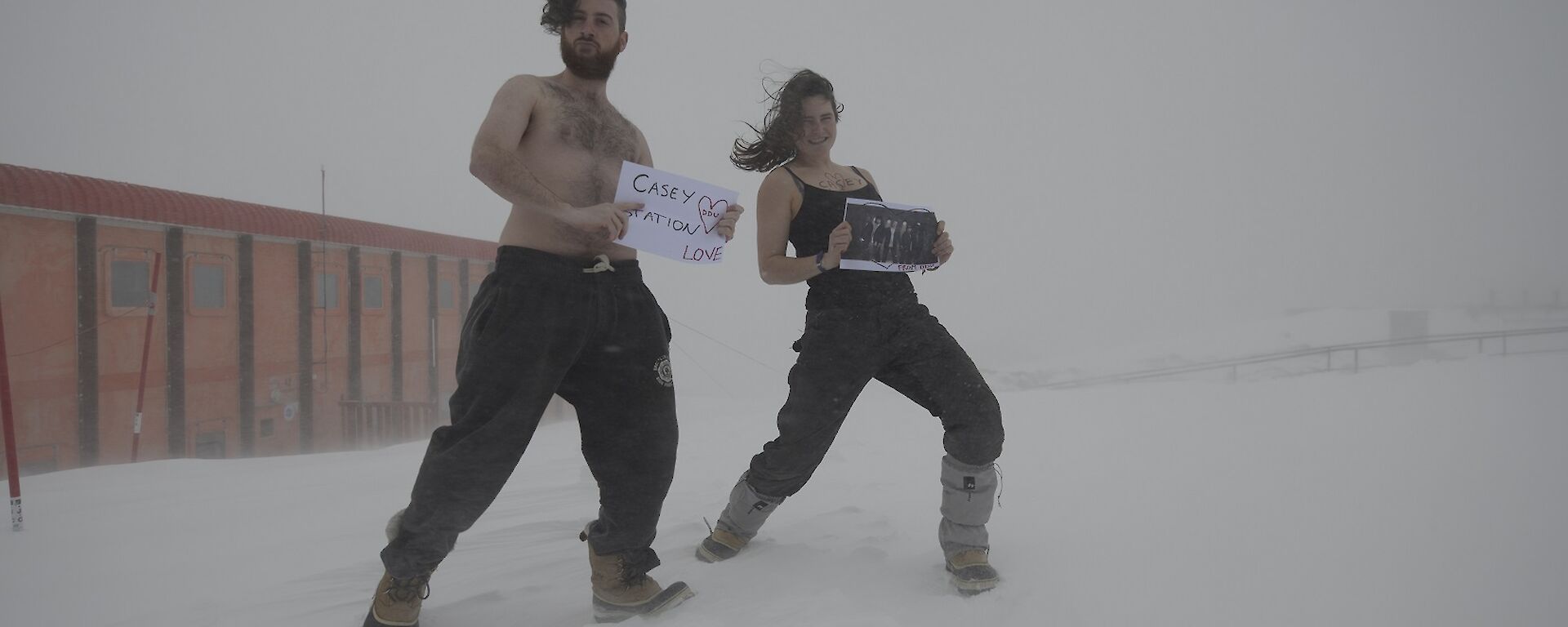 Two expeditioners in snow.