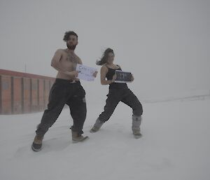 Two expeditioners in snow.