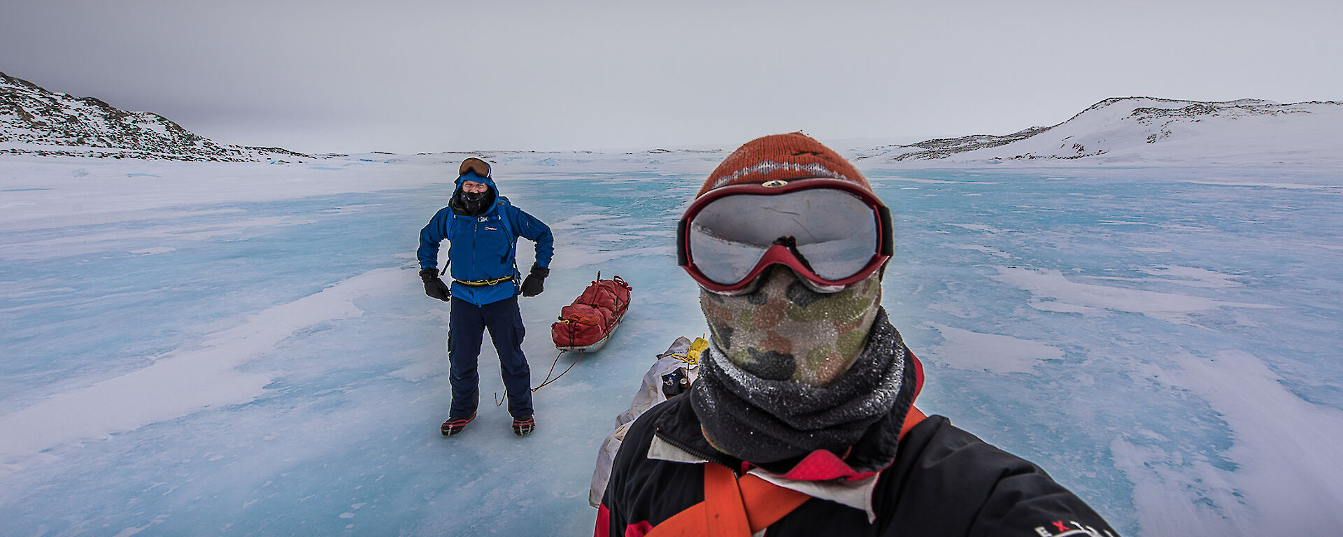 Mark and Stu on the sea ice with sleds.