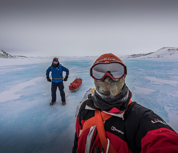 Mark and Stu on the sea ice with sleds.