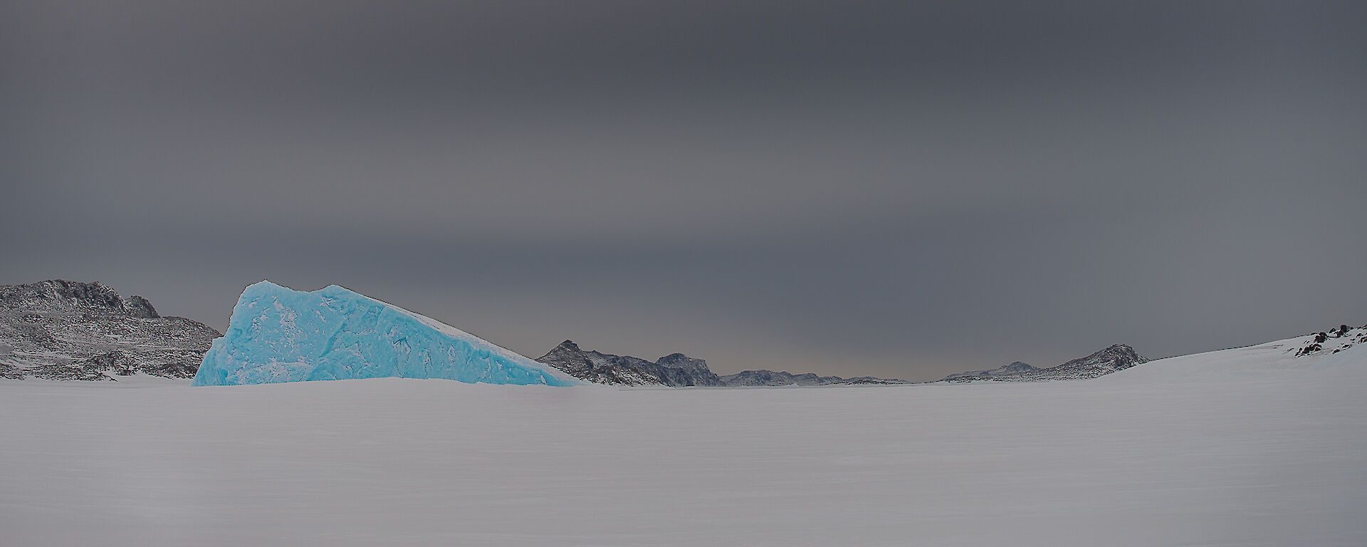 Browning Peninsula — some hills in the background covered in snow.