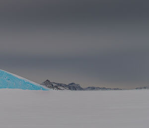 Browning Peninsula — some hills in the background covered in snow.