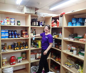 Ash in the pantry cleaning the shelves.