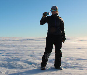 Jacque standing on blue ice.