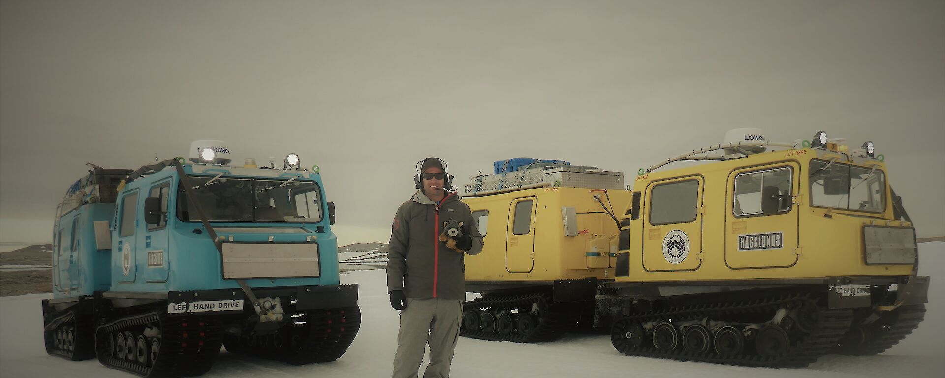 Rick standing outside in front of three Häggs.